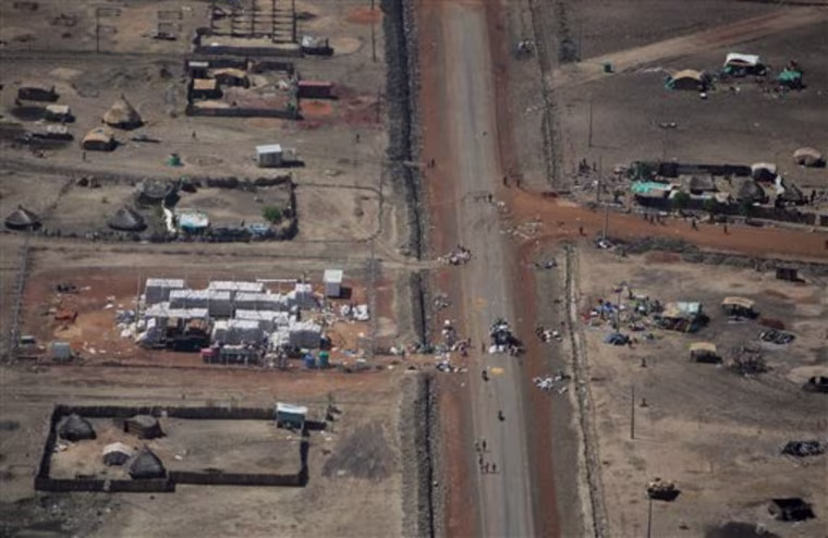 In this photo released by the United Nations Mission in Sudan (UNMIS), an unidentified compound is looted in the town of Abyei, Sudan, Monday, May 23, 2011. Armed men burned and looted the flashpoint town of Abyei on Monday, the U.N. mission said, while Southern Sudan's military said the northern army is moving to carry out a \"full-scale war\" in the contested region. (AP Photo/UNMIS, Stuart Price) EDITORIAL USE ONLY, NO SALES